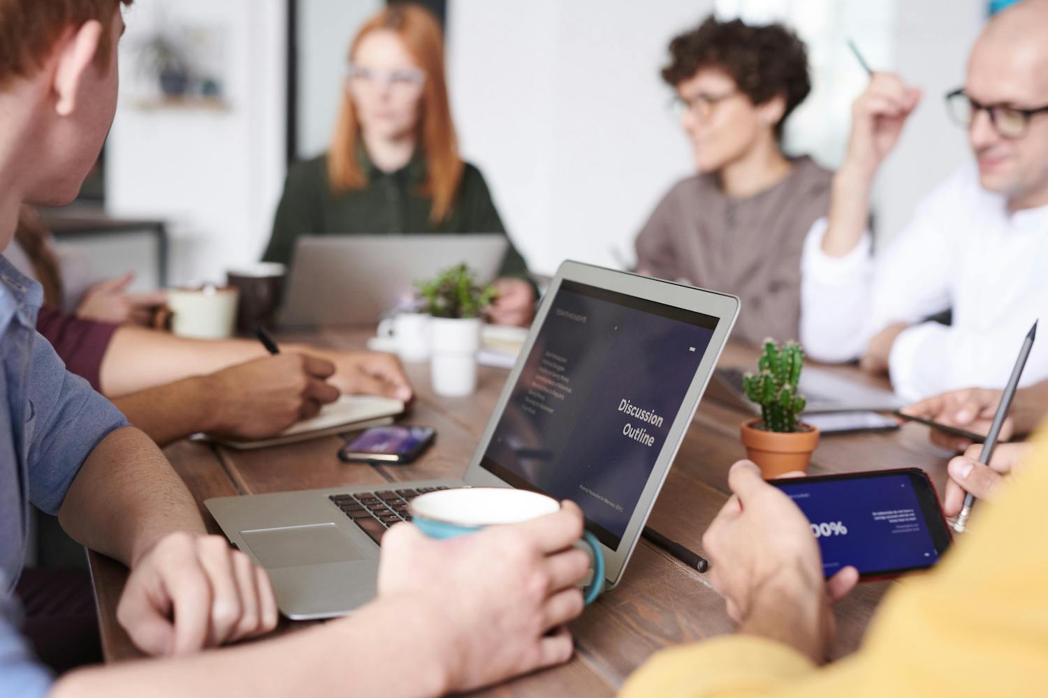 people sit at table for meeting