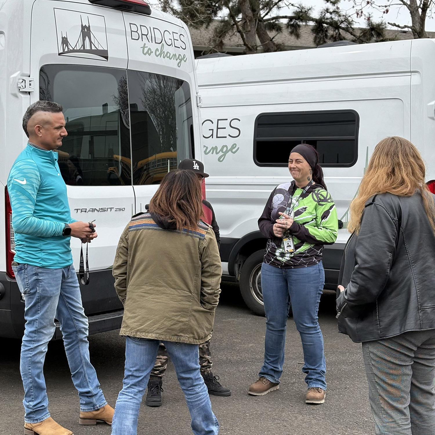 Immediate Care team in front of Bridges to Change vans